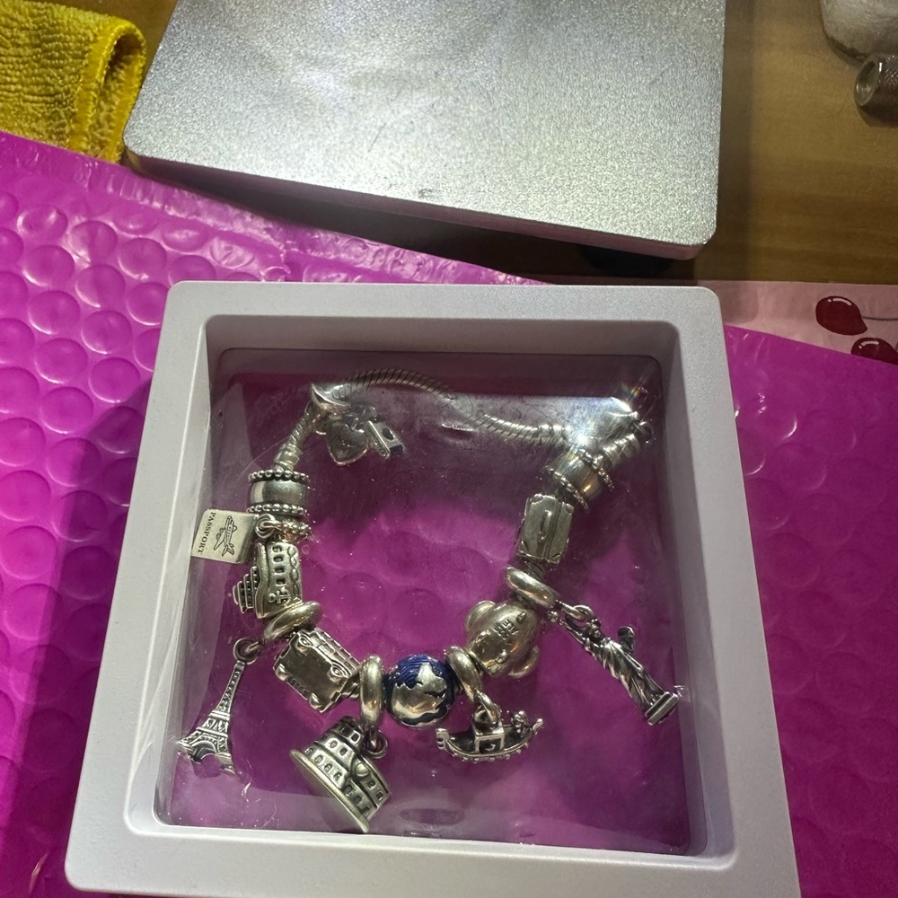 authentic Pandora Travelers charm bracelet. It’s a must have if u travel a-lot. - Picture 9 of 9